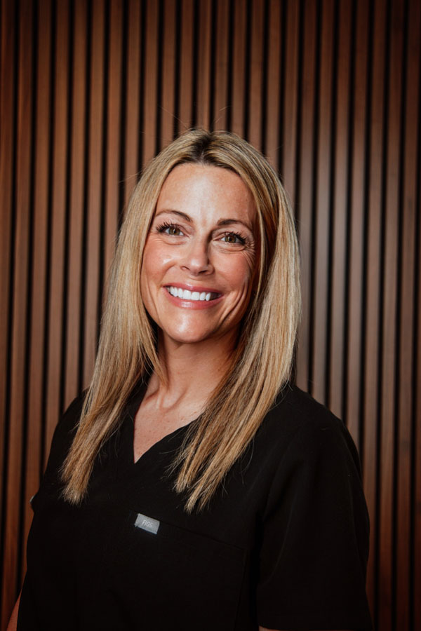 Female healthcare professional in black medical uniform
